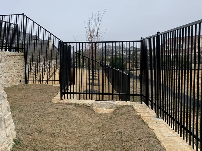 Flat-top steel fence with a matching walk gate