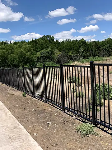 Greenbelt trail edge above a creek, Master-planned community